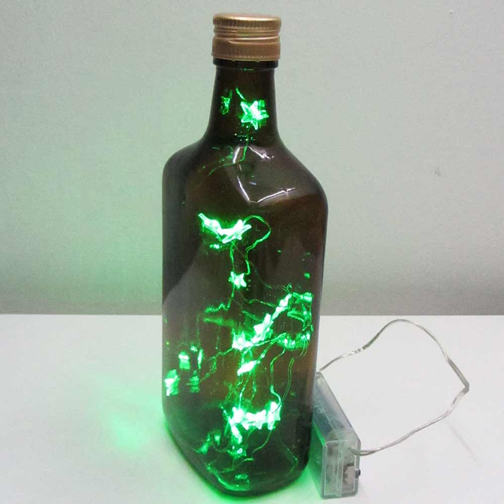 I was a bottle: Glas-Flaschen - Lampen und Leuchten, Laternen, Gläser, Vasen und Schalen aus Glas, Led-Flaschenlampen: braune Rum Flaschenlampe mit grünem Sternen-Ledlicht, Detail
